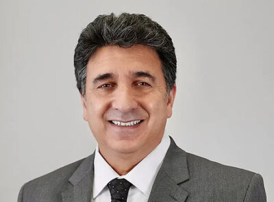 Smiling middle-aged man in gray suit