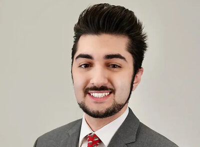 Smiling young man in suit and tie