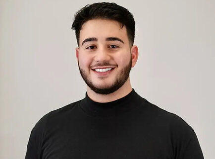 Smiling young man in black shirt