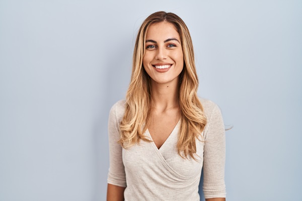 Smiling woman with long blonde hair